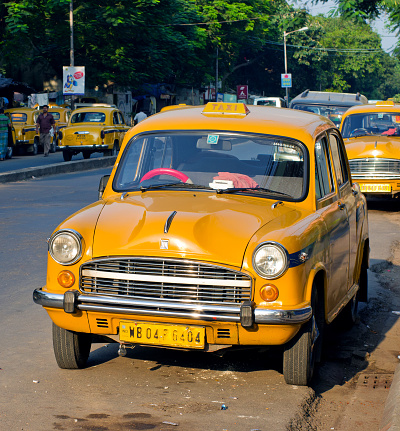 Kolkata, India - October 6, 2014: Yellow taxi cabs in Kolkata, India.