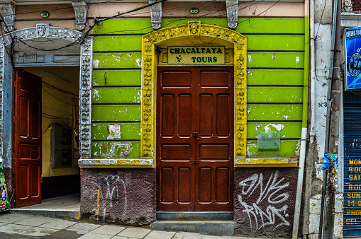 La Paz, Bolivia - August 31, 2014: Typical street in La Paz, Bolivia with colonial architecture in varying states of neglect.