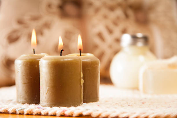 Spa holiday. Composition with towels, candle and soap bars on wooden table against beautiful mountain landscape