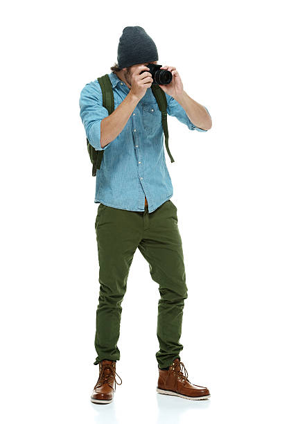 istock Photographer in action with camera 519875628