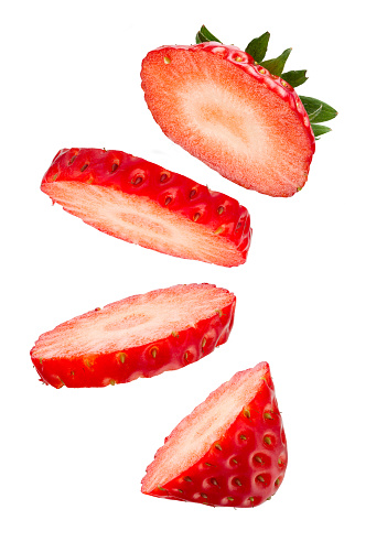 Beautiful Sliced Fresh Strawberry Floating on White Background in Full Depth of Field with Clipping Path.