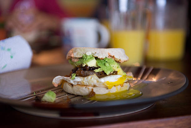 istock Breakfast sandwich with avocado and runny egg 519886685