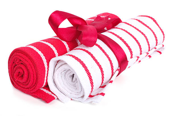 istock Two towels associated with tape and rolled up isolated 519888699