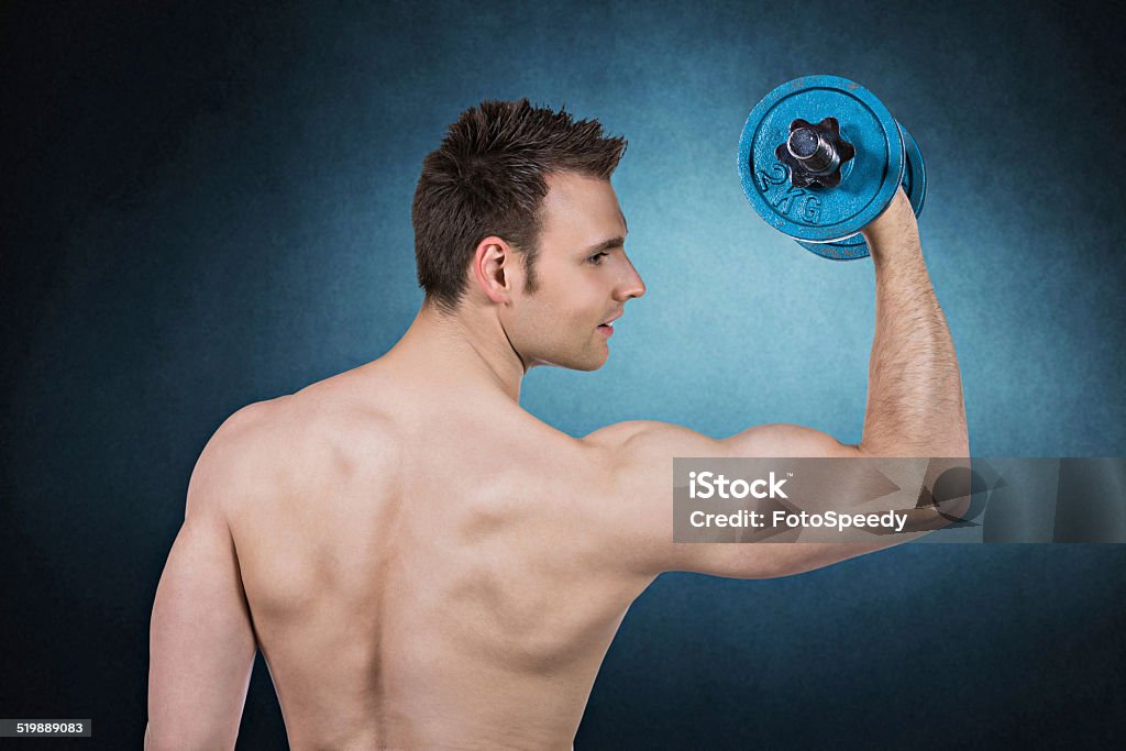 Handsome Muscular Men Handsome muscular men lifting weights Active Lifestyle Stock Photo