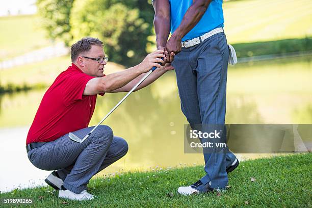 Golf Pro Teaching Male Golfer Stock Photo - Download Image Now - Assistance, Golf, Adult