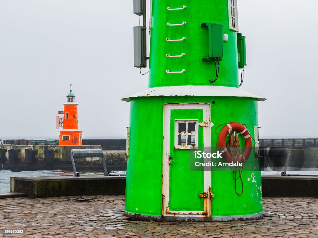 Two old lighthouses in a foggy day Two old lighthouses in a rainy day, Helsingor, Denmark Beach Stock Photo