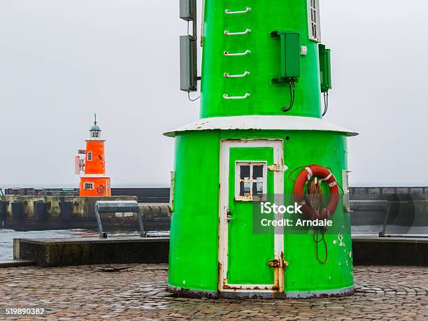 Two Old Lighthouses In A Foggy Day Stock Photo - Download Image Now - Beach, Beacon, Building Exterior