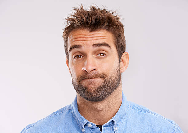 I don't know about this Studio shot of a handsome man looking uncertain against a gray background confusion raised eyebrows human face men stock pictures, royalty-free photos & images