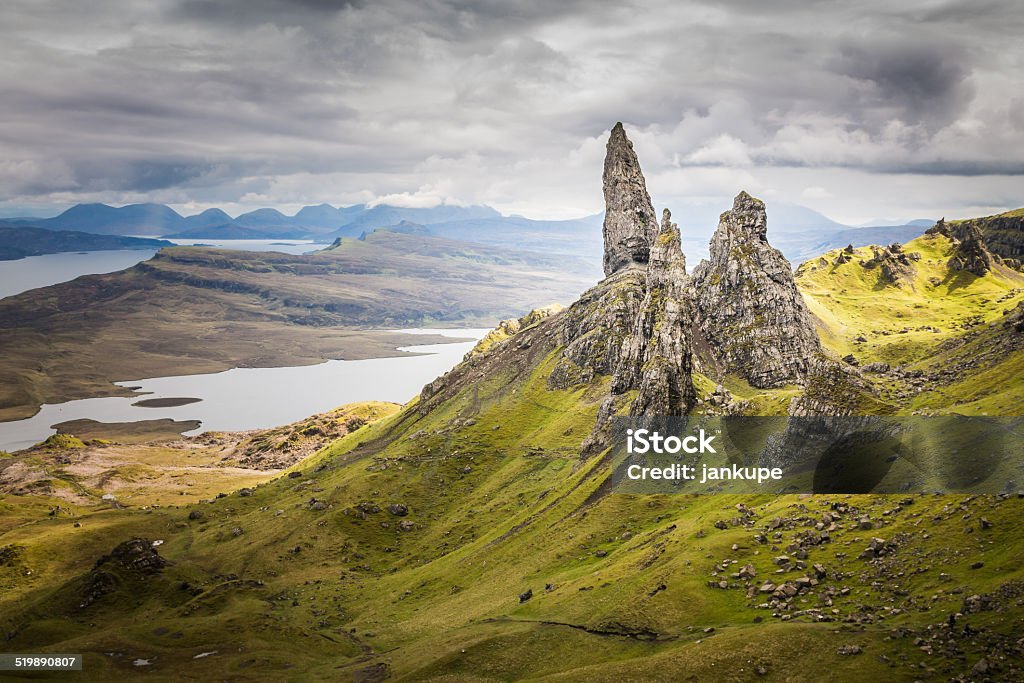The Old Man of Storr on the Isle of Skye View of the Old Man of Storr with dramatic cloudy sky, the Isle of Skye in the Highlands of Scotland, United Kingdom. Adult Stock Photo