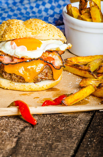 istock Homemade burger with fried egg and spicy fries 519891071