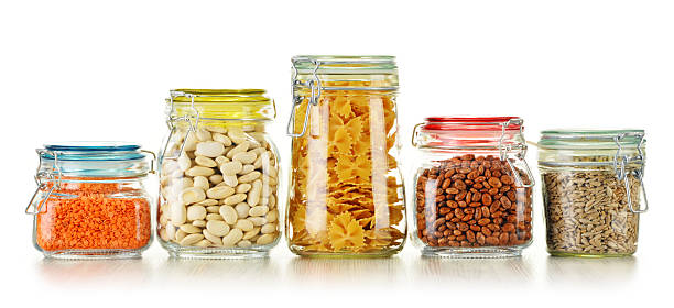 istock Jars with grain foods isolated on white 519891097