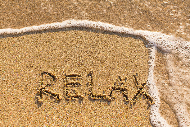 istock Relax - drawn on the sand of a sea beach. 519891192
