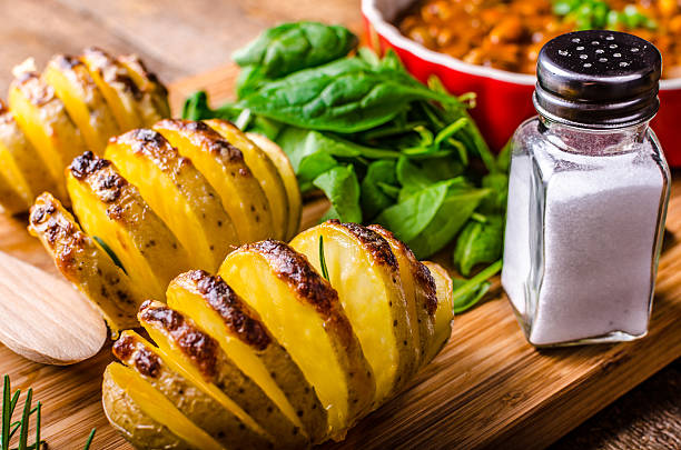 istock Spicy cowboy beans with hassleback potatoe with herbs 519891395