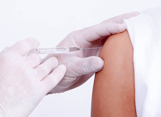 istock Nurse giving a vaccine for a patient 519892063
