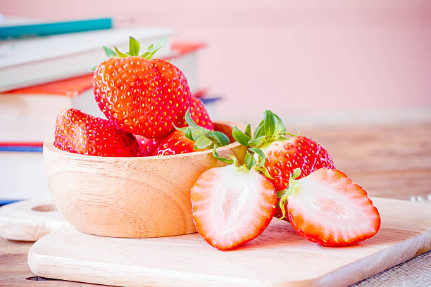 istock Fresh strawberries on wooden table. 519893554