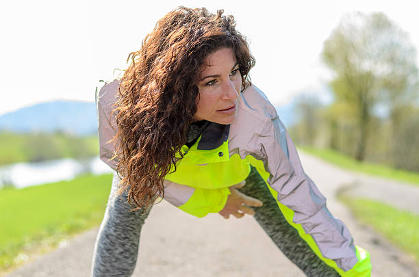istock Smiling attractive woman working out 519894954
