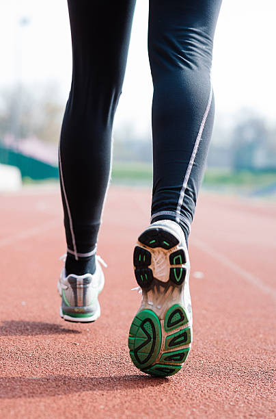 istock Female athlete ready for jogging on track and field 519897976