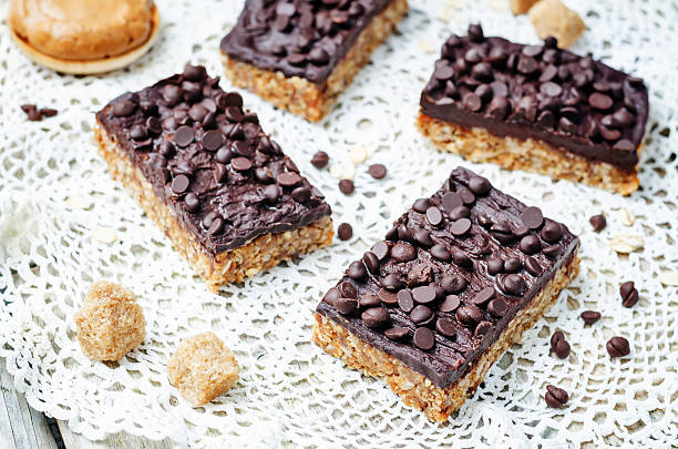 istock raw vegan dates oats peanut butter bars with chocolate frosting 519898428