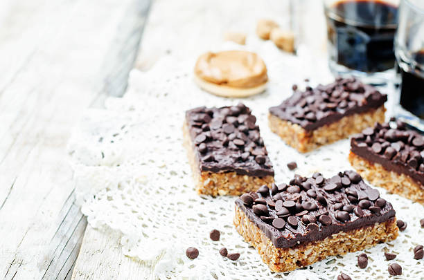 istock raw vegan dates oats peanut butter bars with chocolate frosting 519898450