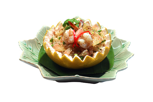 Thai Pomelo spicy salad with shrimp served in pomelo,