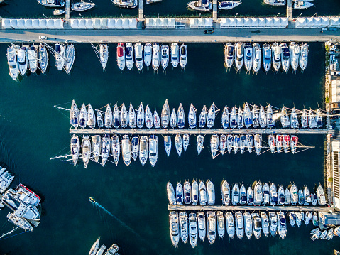 Aerial view on marina bay with sailboats and yachts. Shot from a drone Phantom 3 Professional. http://santoriniphoto.com/Template-Sailing.jpg