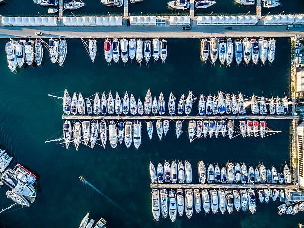 Marina bay with sailboats and yachts Aerial view on marina bay with sailboats and yachts. Shot from a drone Phantom 3 Professional. http://santoriniphoto.com/Template-Sailing.jpg marina photos stock pictures, royalty-free photos & images