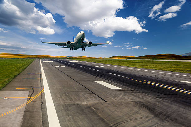 istock Airplane landing on a sunny day 519899426
