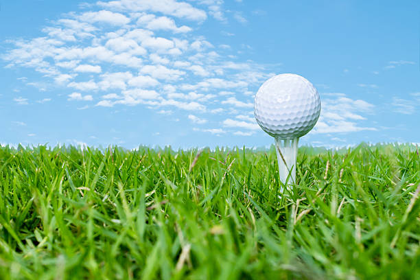istock Golf ball on tee with blue sky background as abstract 519909935
