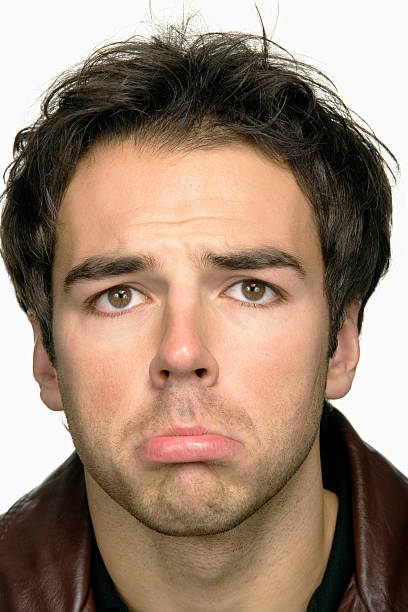 istock Young man making face, portrait, close-up 519911391