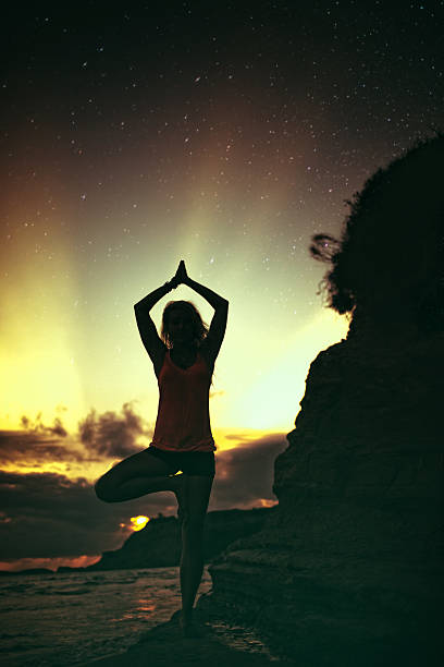 istock Greeting to the Sun in Yoga Tree position 519912631