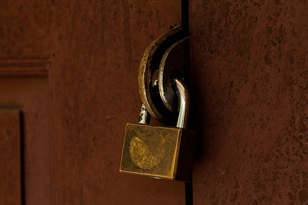 istock locked old wooden door. 519912825