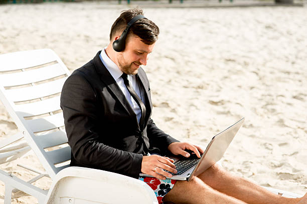 istock Businessman on the beach 519912875