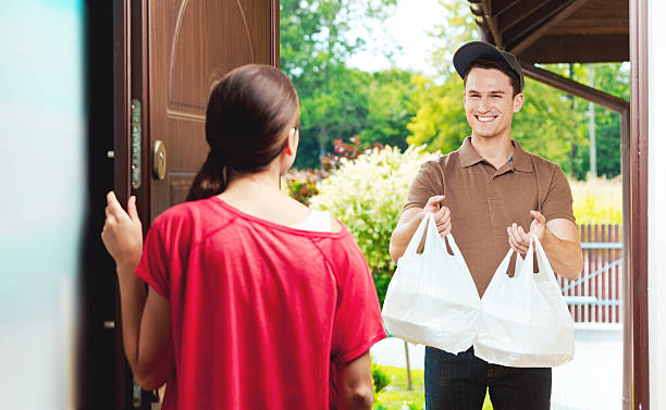 istock Delivery man delivering chinese take away food 519912933