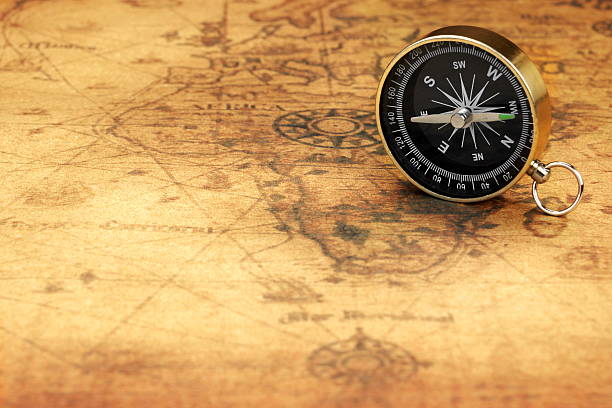 istock Close Up Of Magnetic Compass On The Old Map 519914110