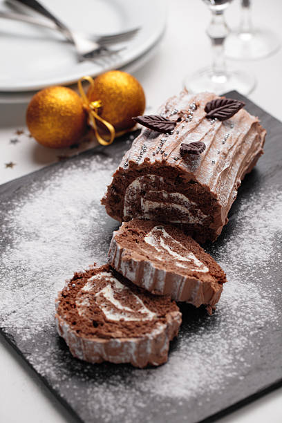 Yule log cake on a Christmas table stock photo