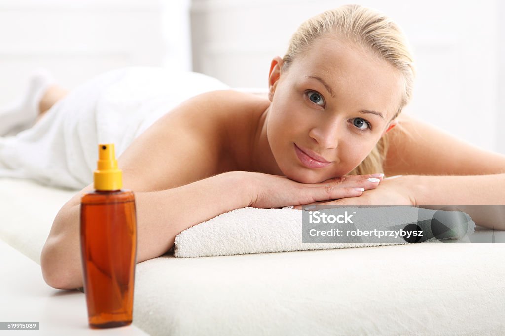 Cosmetic - woman at massage Portrait of a beautiful woman in a beauty salon, relaxation, luxury, peace  Adult Stock Photo