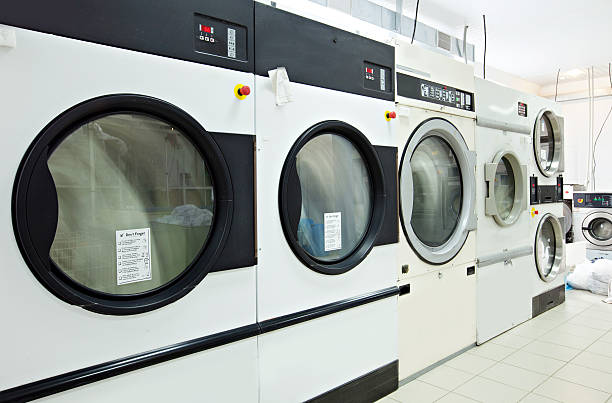 istock Close-up on rotating drums of washing machines 519915727