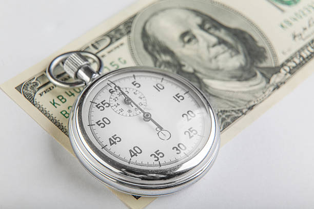 [stopwatch ](ストップウォッチ)は、アメリカの 100 ドル - finance photography us currency stopwatch ストックフォトと画像