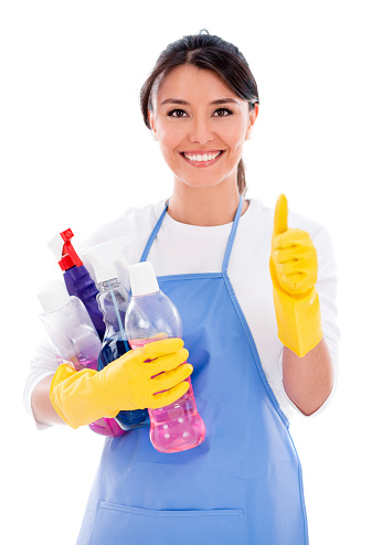 Happy maid with cleaning products and thumbs up