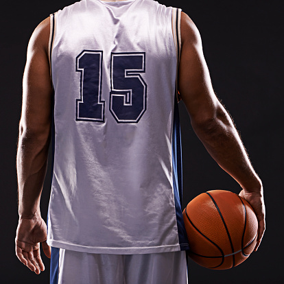 Basketball uniform and ball on white background, top view