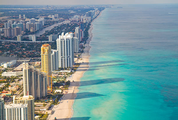 Miami South Beach Aerial shot of Miami South Beach full of hotels with some long shadows reaching into the sea. Florida, USA. south beach stock pictures, royalty-free photos & images