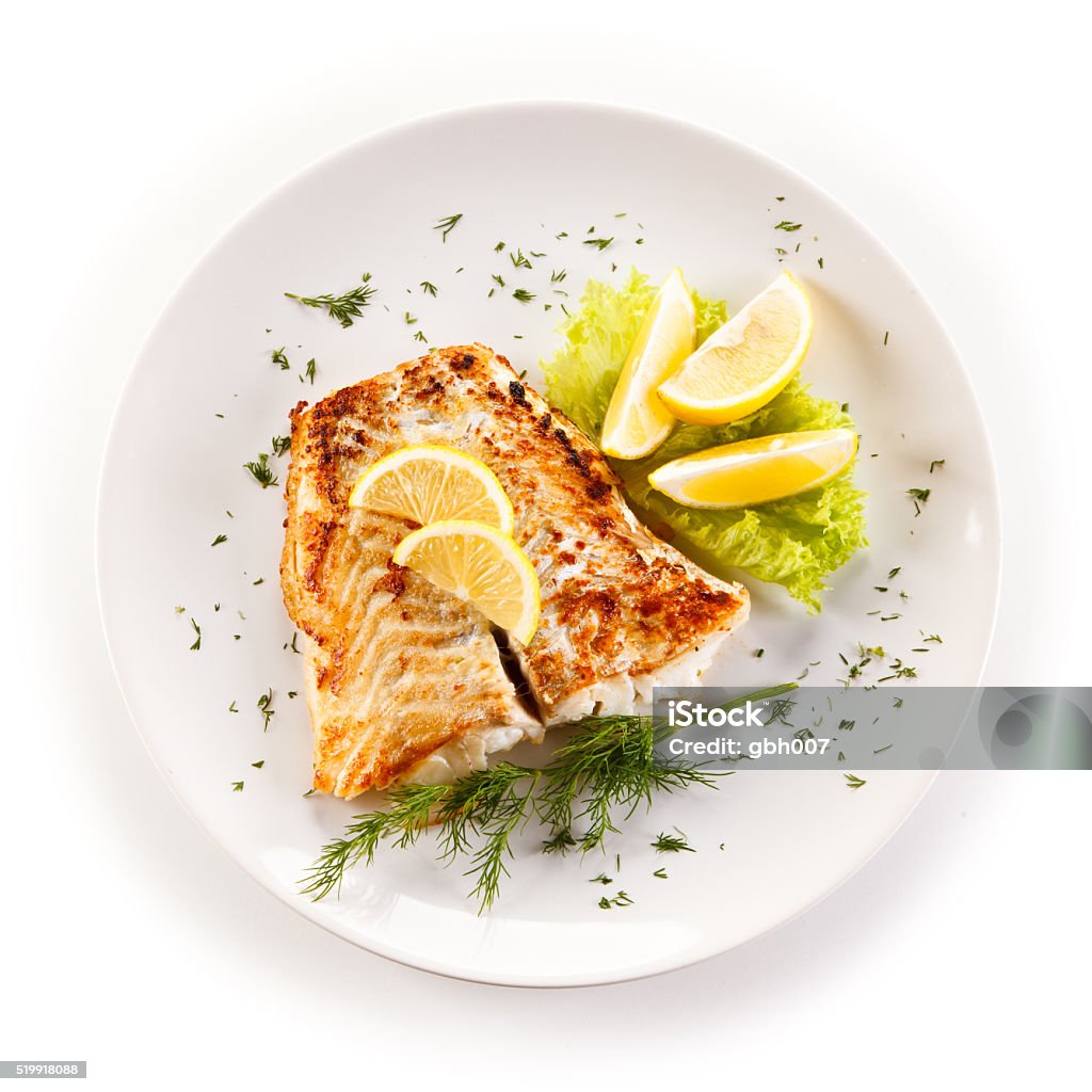 Fried cod fillets and vegetables Fish dish Fish Stock Photo