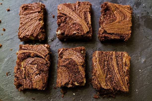 istock Marble cake brownies on stone slate dark background 519919716