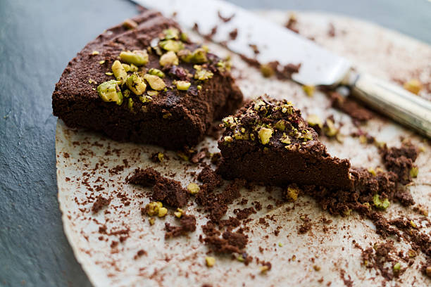 istock Crumbling last piece dark chocolate and pistachio cake 519919916