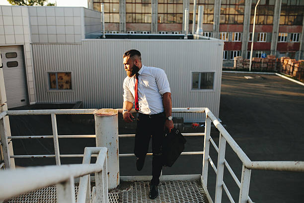 istock businessman looks into the distance 519923332