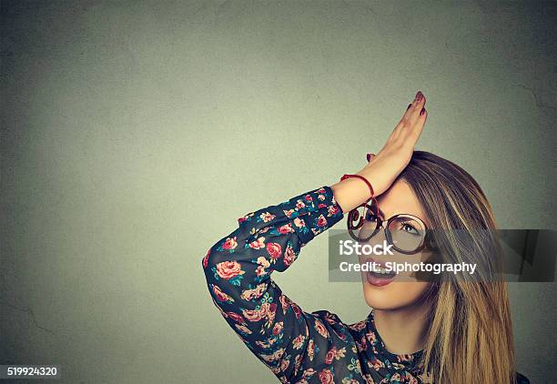 Silly Woman Slapping Hand On Head Having Duh Moment Stock Photo - Download Image Now