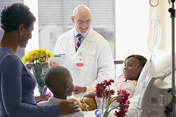 Doctor with patient and family