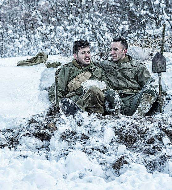 istock WWII US Army Soldier Buddies Relaxing Talking In Foxhole 519925222