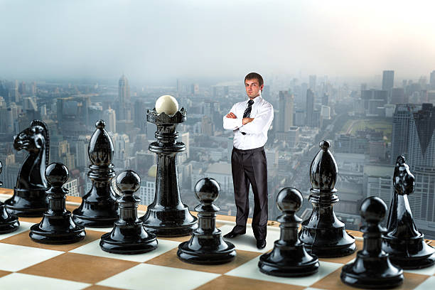 istock Businessman on the chess board 519926152