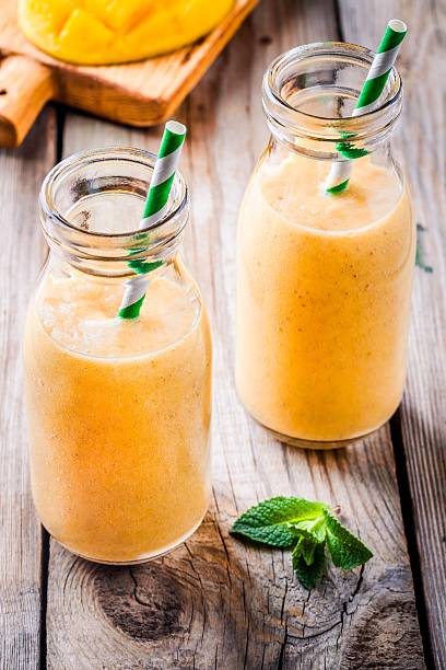 istock tropical smoothie in glass bottles 519926582